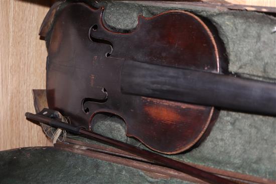 A mid 19th century German violin, bears Nicolas label, cased with a silver mounted bow, back 36cm